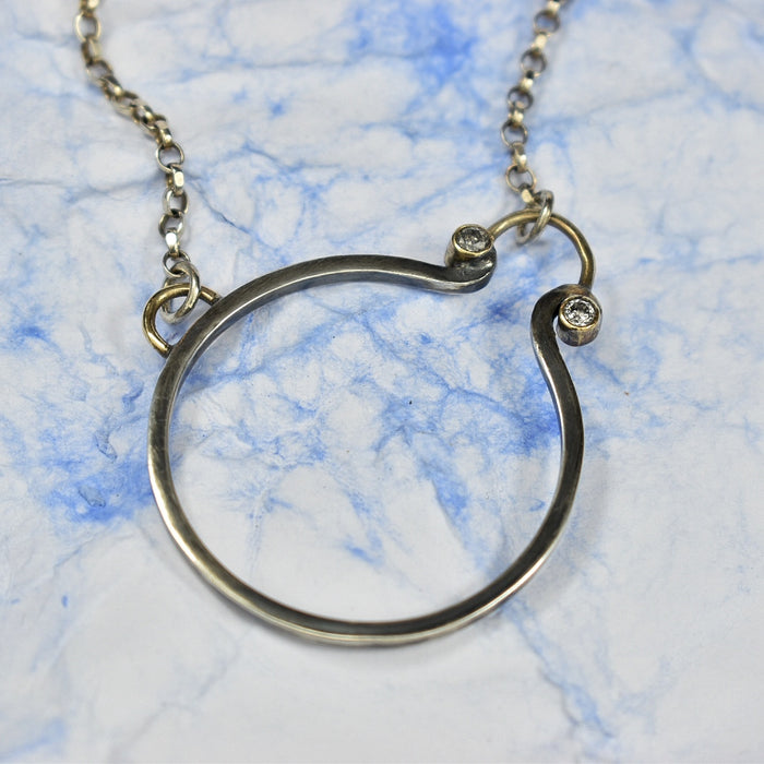 Salt and pepper diamond circle necklace with silver and gold