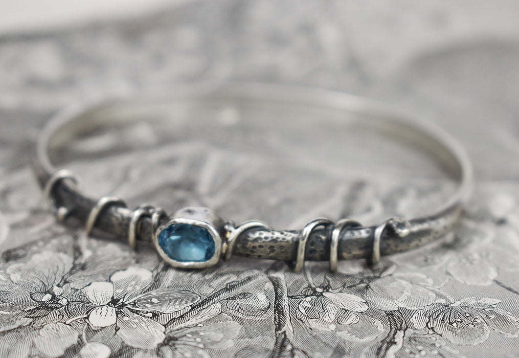 Blue topaz and silver vine bangle