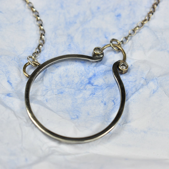 Salt and pepper diamond circle necklace with silver and gold